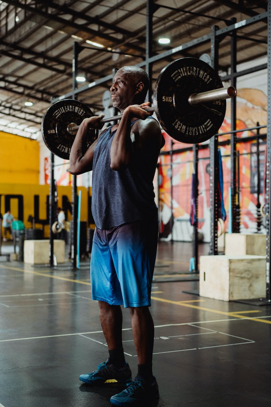 fit man lifting barbell